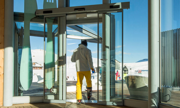man working an airport air lock door